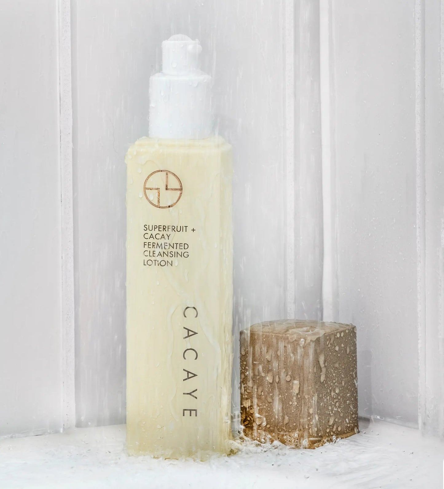 
                  
                    CACAYE SUPERFRUIT + CACAY FERMENTED CLEANSING LOTION BOTTLE IN SHOWER WITH LID OFF
                  
                