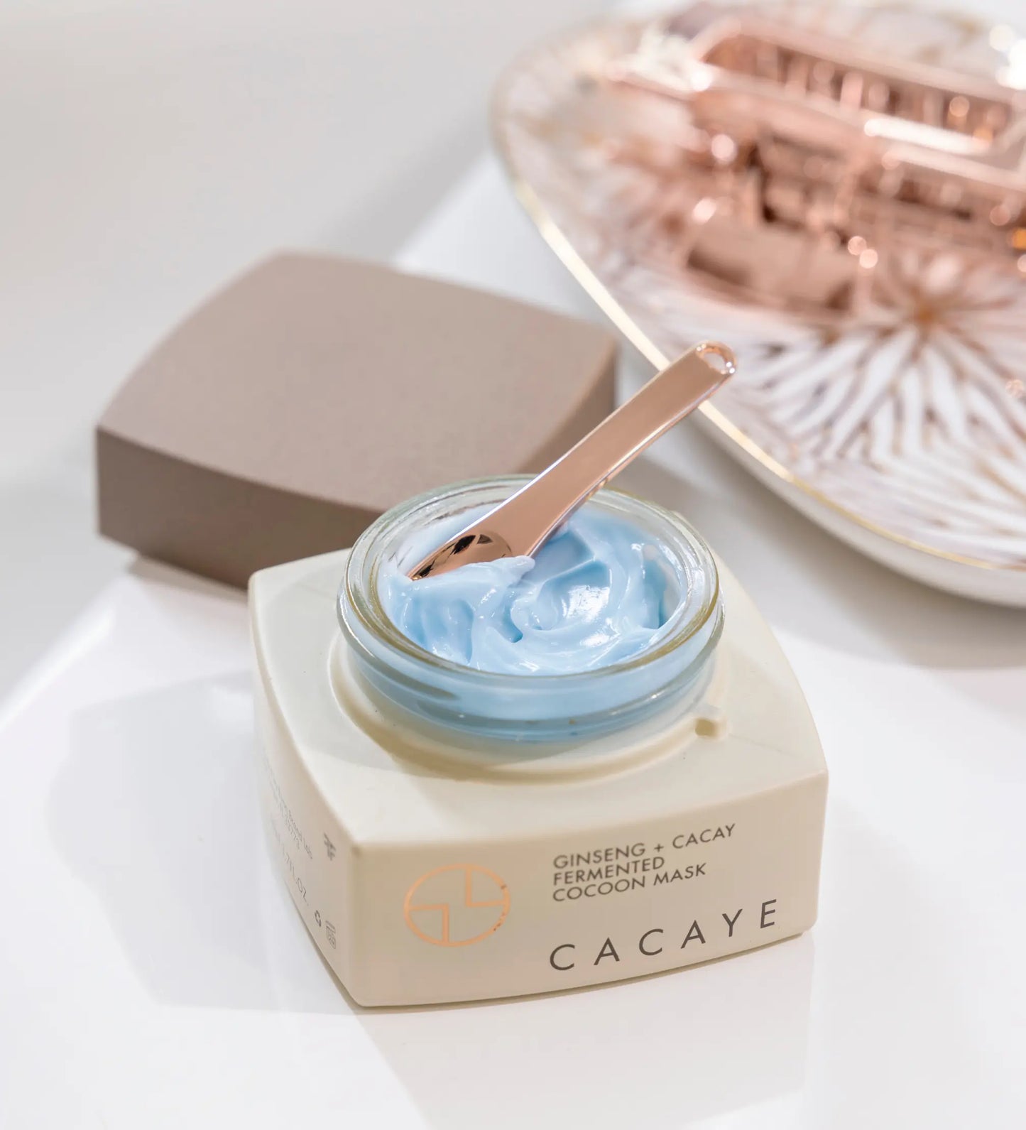 CACAYE GINSENG+ CACAY COCOON MASK JAR WITH OPEN LID AND SPATULA