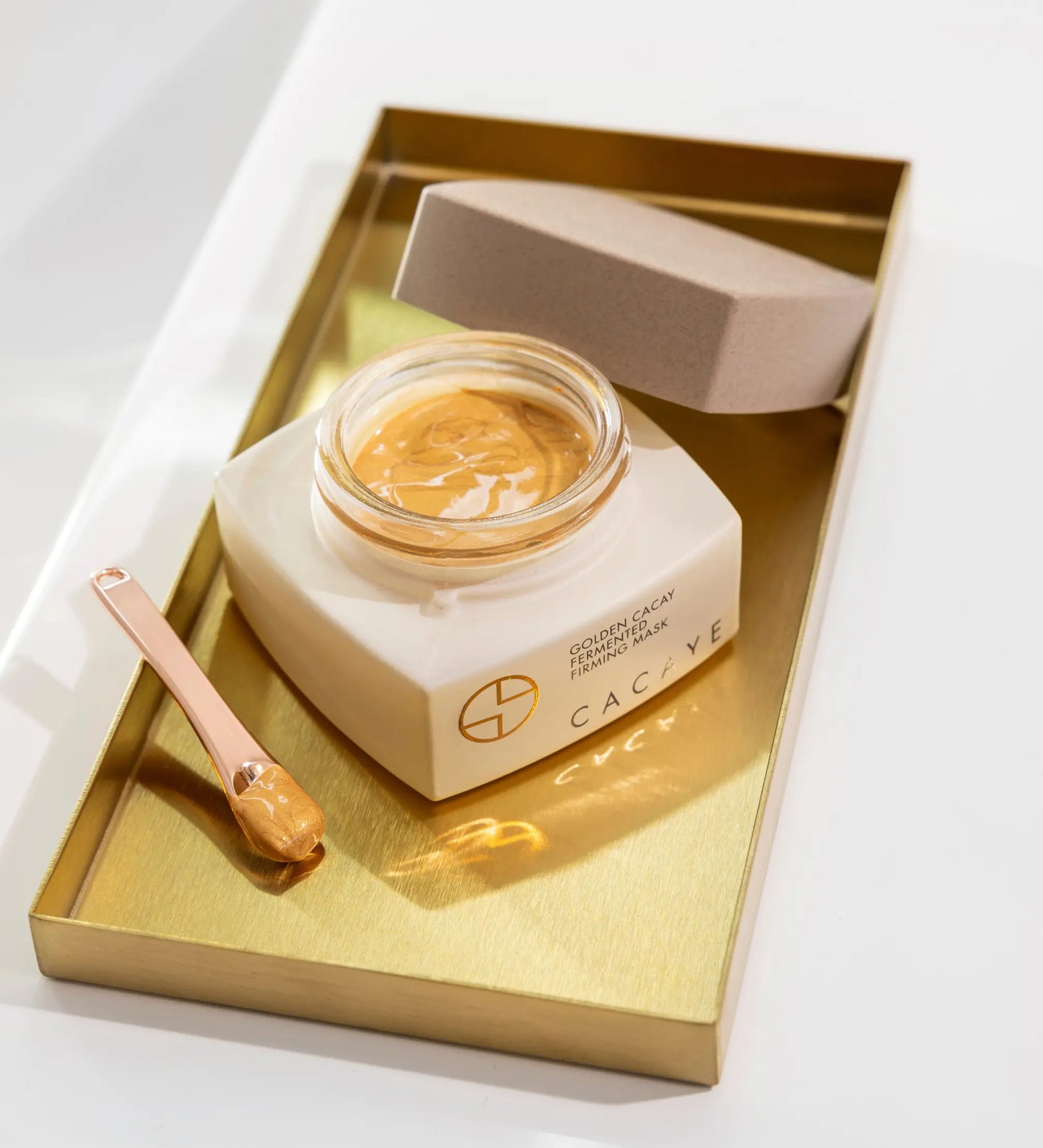 CACAYE GOLDEN CACAY FERMENTED FIRMING MASK OPEN JAR WITH SPATULA