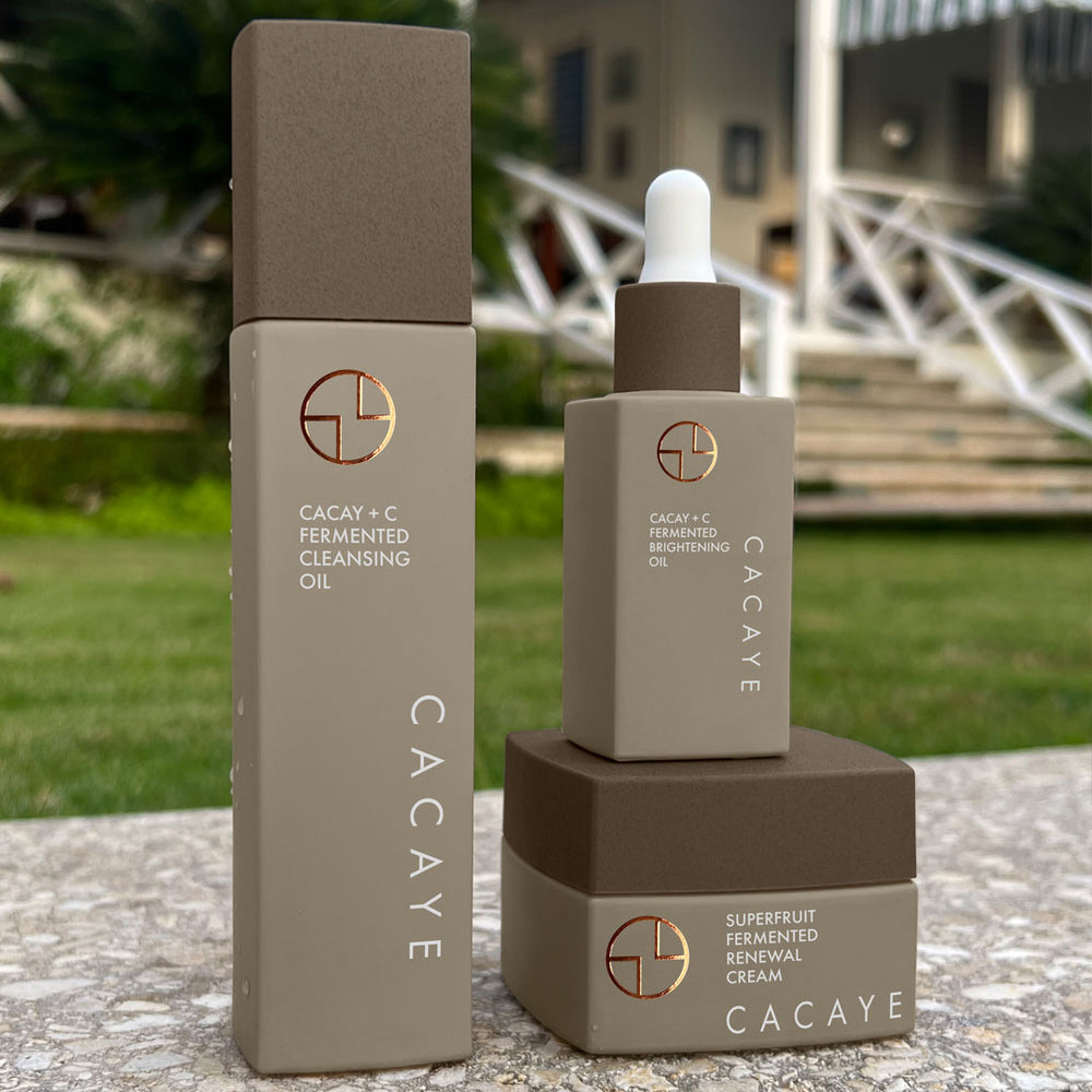 
                  
                    CACAYE CaCay + Fermented Skincare Trio Holiday Set in tropical hotel setting
                  
                