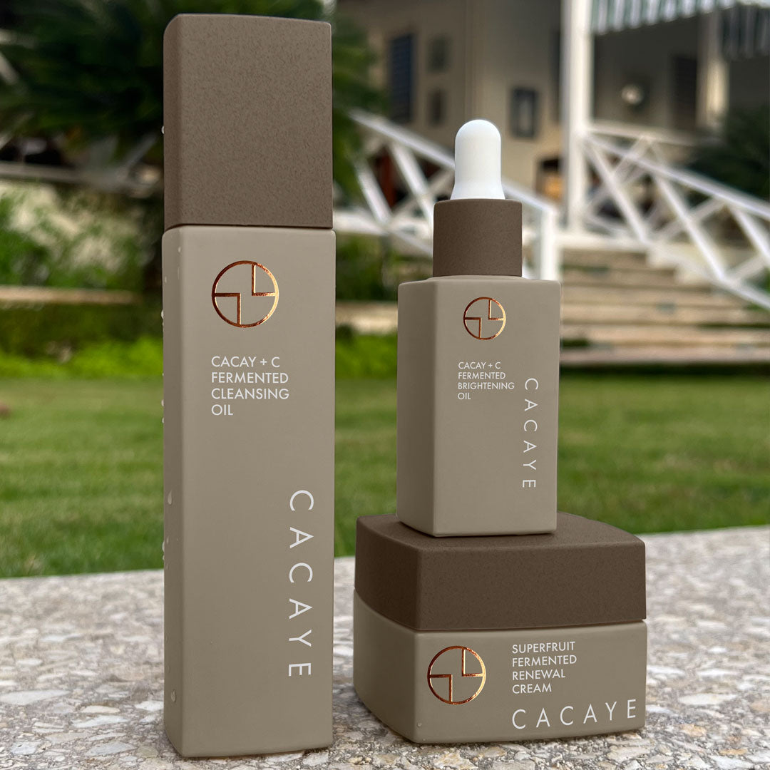 
                  
                    CACAYE CaCay + Fermented Skincare Trio Holiday Set in tropical hotel setting
                  
                